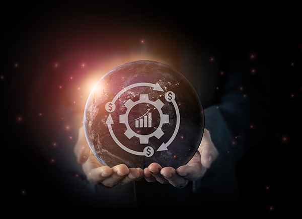 Business concept: hands holding a globe with financial icons, symbolizing global economic growth and networking.